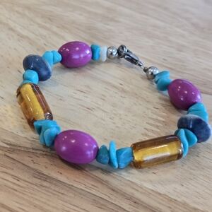 Artisan handcrafted Bohemian style beaded turquoise purple and amber bracelet.